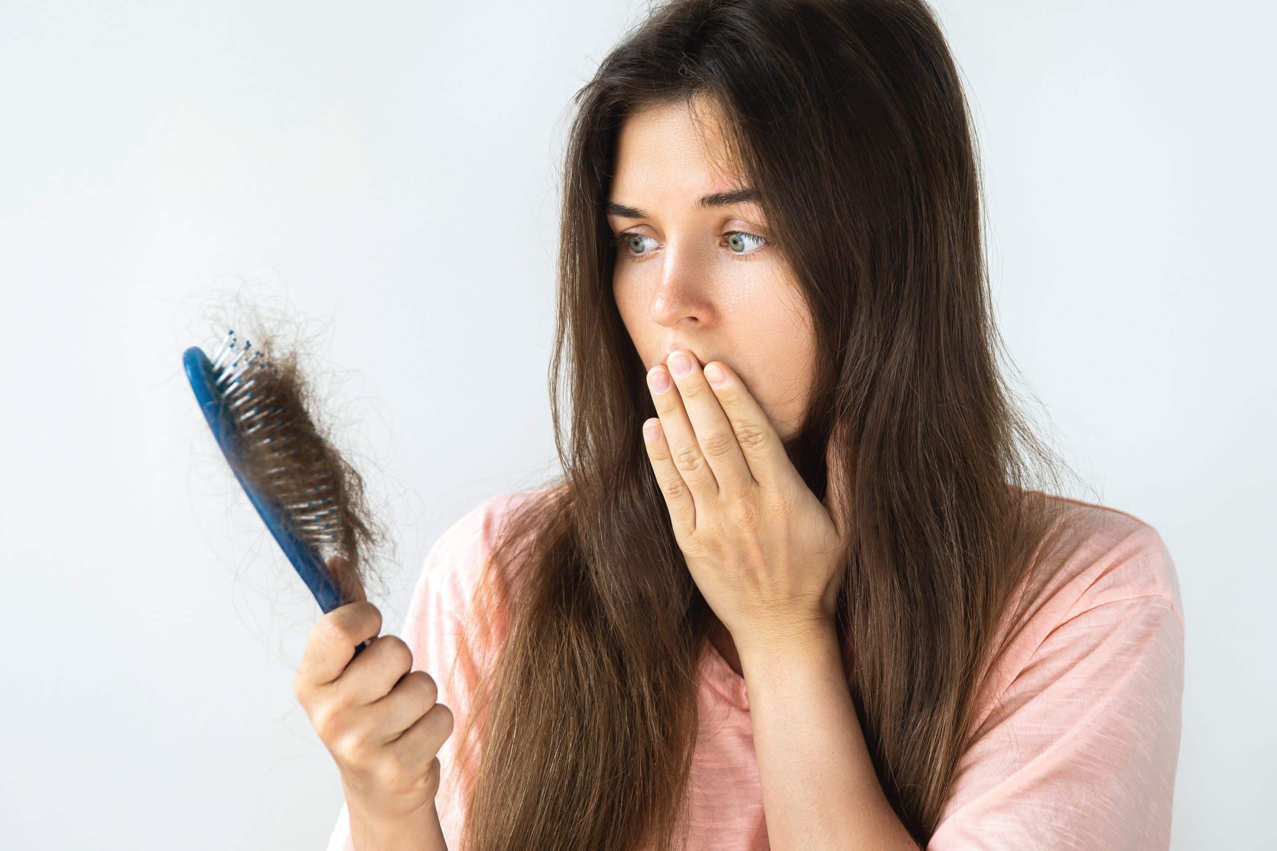 Hair shedding on a brush — seasonal hair loss