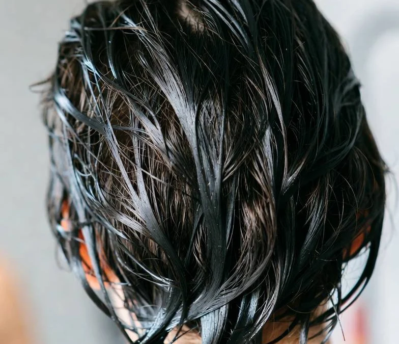 Shampoo for greasy hair being applied to the scalp